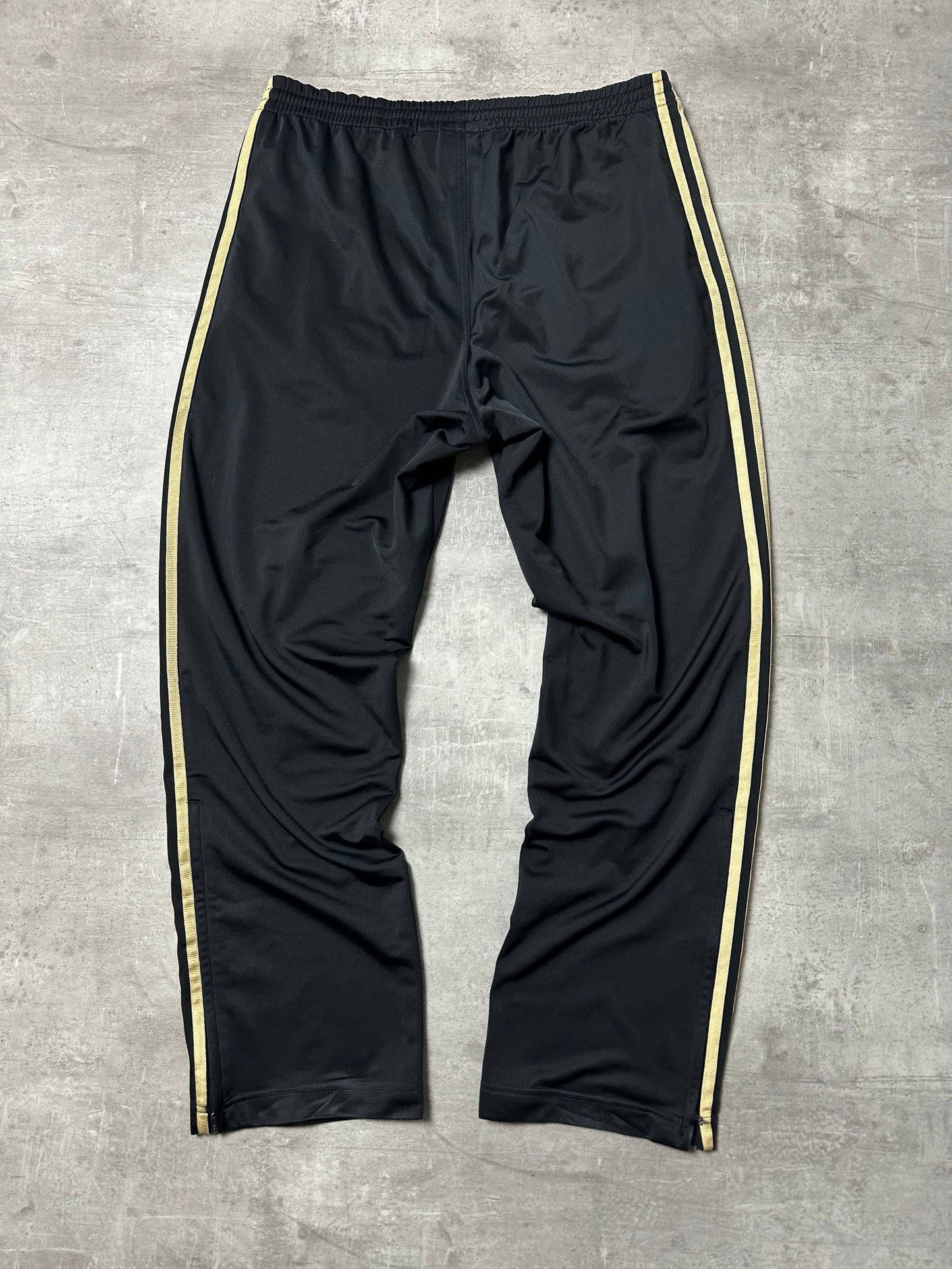 BLACK/GOLD VINTAGE ADIDAS FIREBIRD TRACKPANTS - 2000s - M