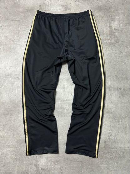 BLACK/GOLD VINTAGE ADIDAS FIREBIRD TRACKPANTS - 2000s - M
