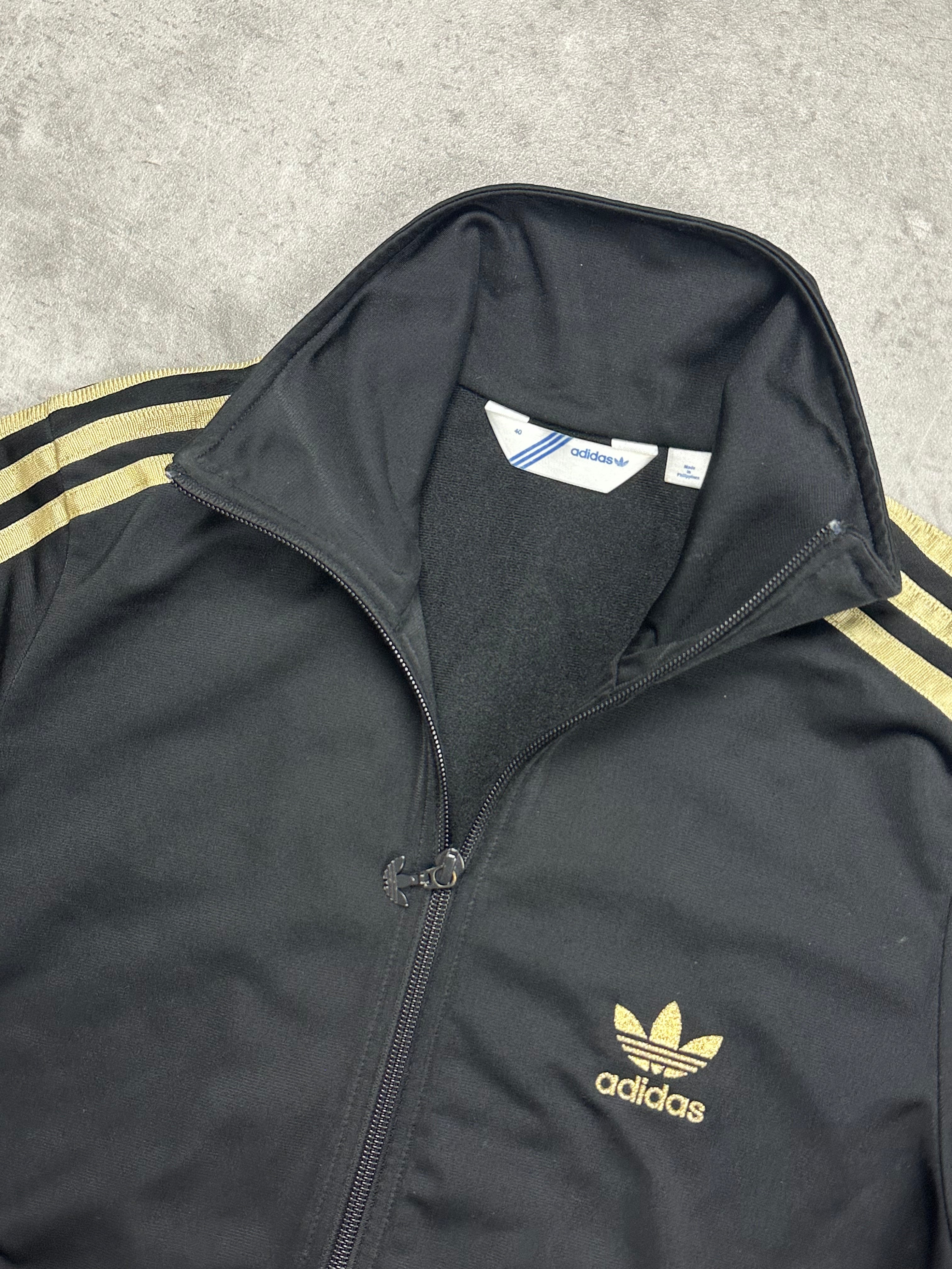 BLACK/GOLD VINTAGE ADIDAS RETRO TRACKJACKET (W) - 2000s - L