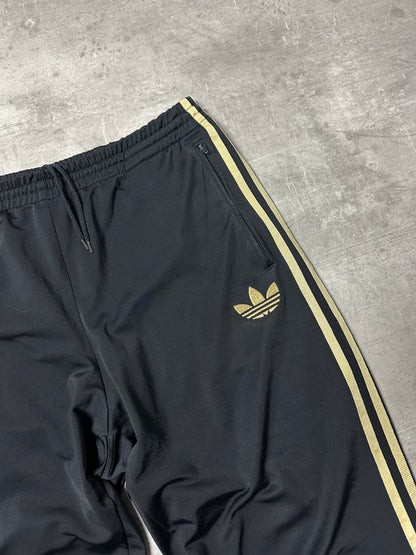 BLACK/GOLD VINTAGE ADIDAS FIREBIRD TRACKPANTS - 2000s - M